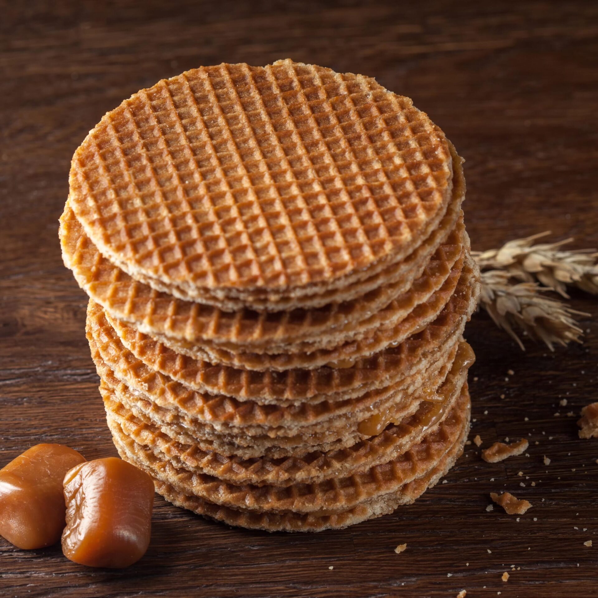 Waffles with caramel on wood